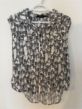 Soaked in Luxury Black & White Zebra Print Sleeveless Button-Down Shirt